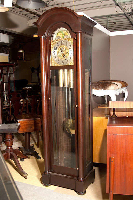 A handsome solid mahogany grandfather clock in fine working condition dated back in 1950s made by Herschede Clock co. The Herschede Hall Clock Company of Starkville, Mississippi. This clock works wonderfully